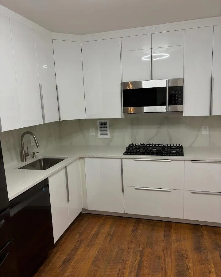 Restored kitchen with white cabinets after water damage in Pembroke Park